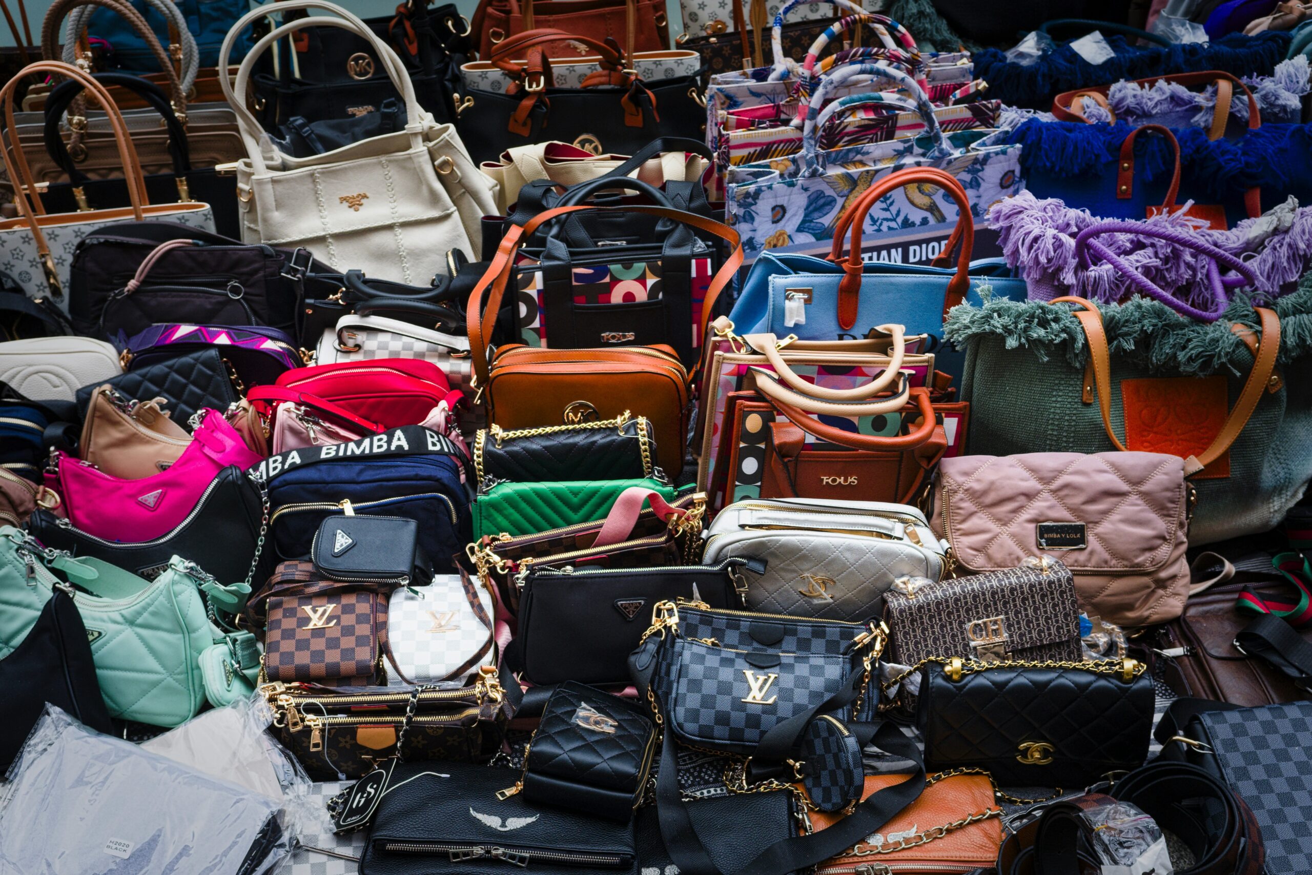 A cluttered suitcase overflowing with clothes and accessories