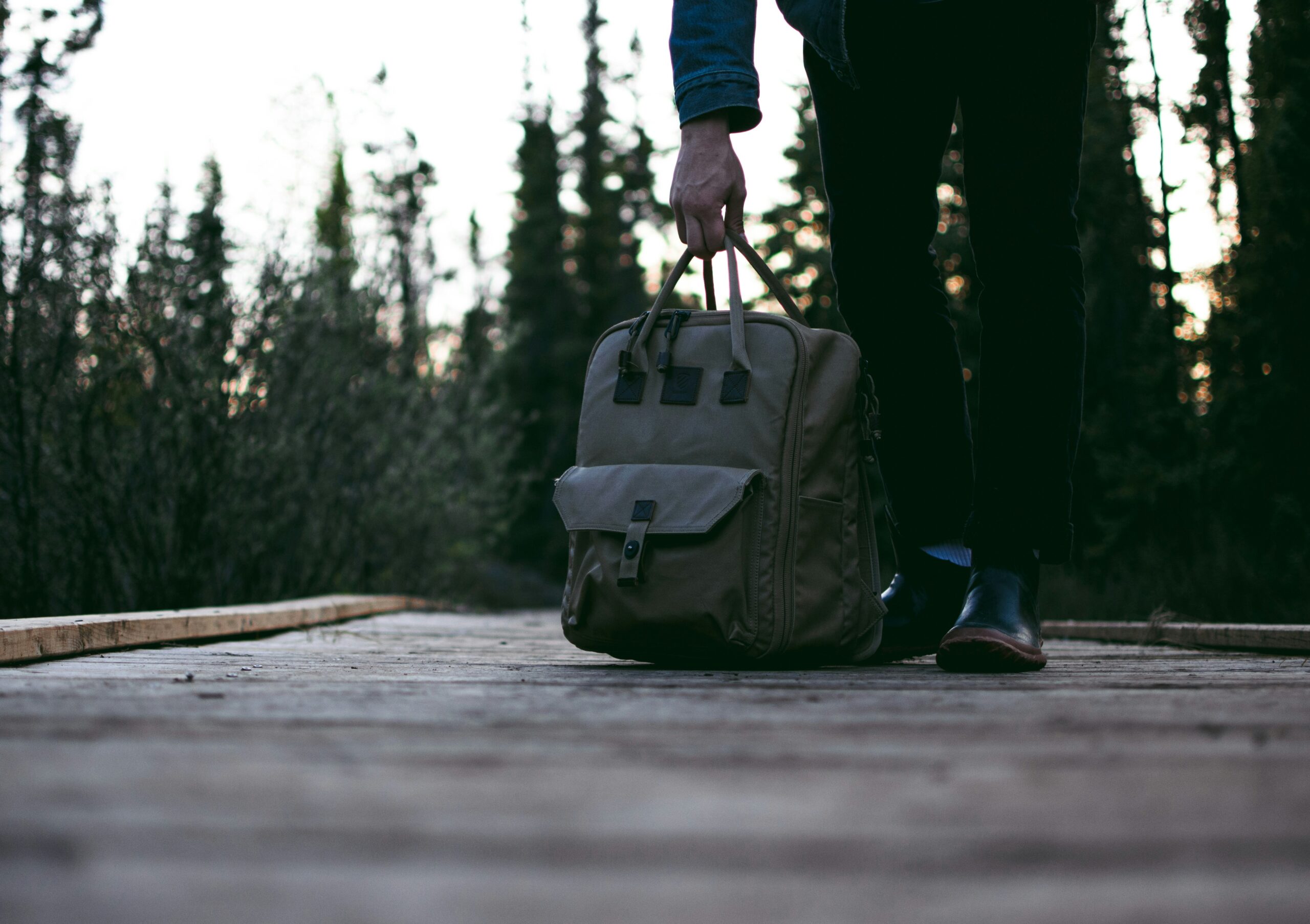 travel backpack on mountain trail