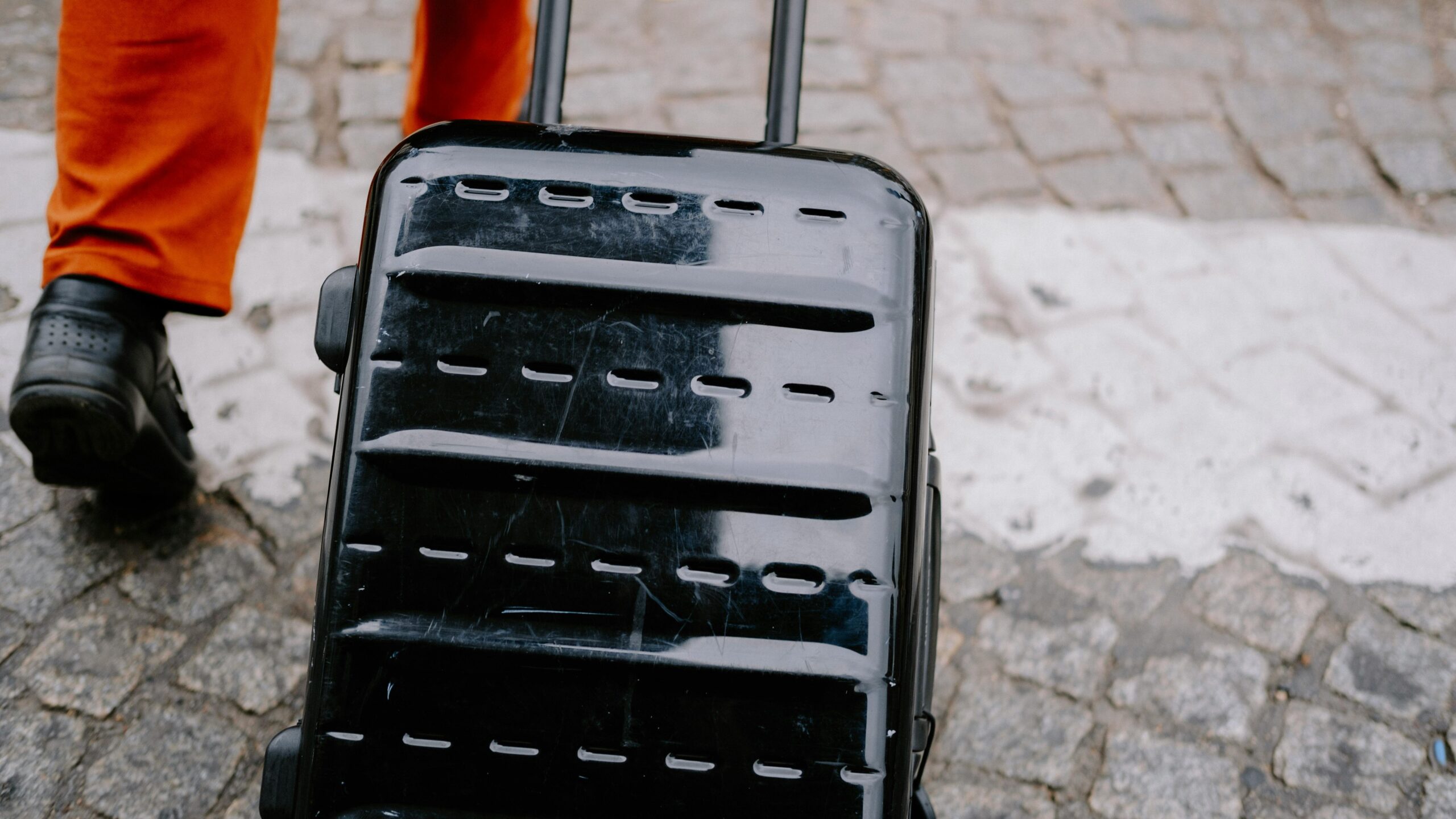 Traveler confidently pulling a roll-up suitcase