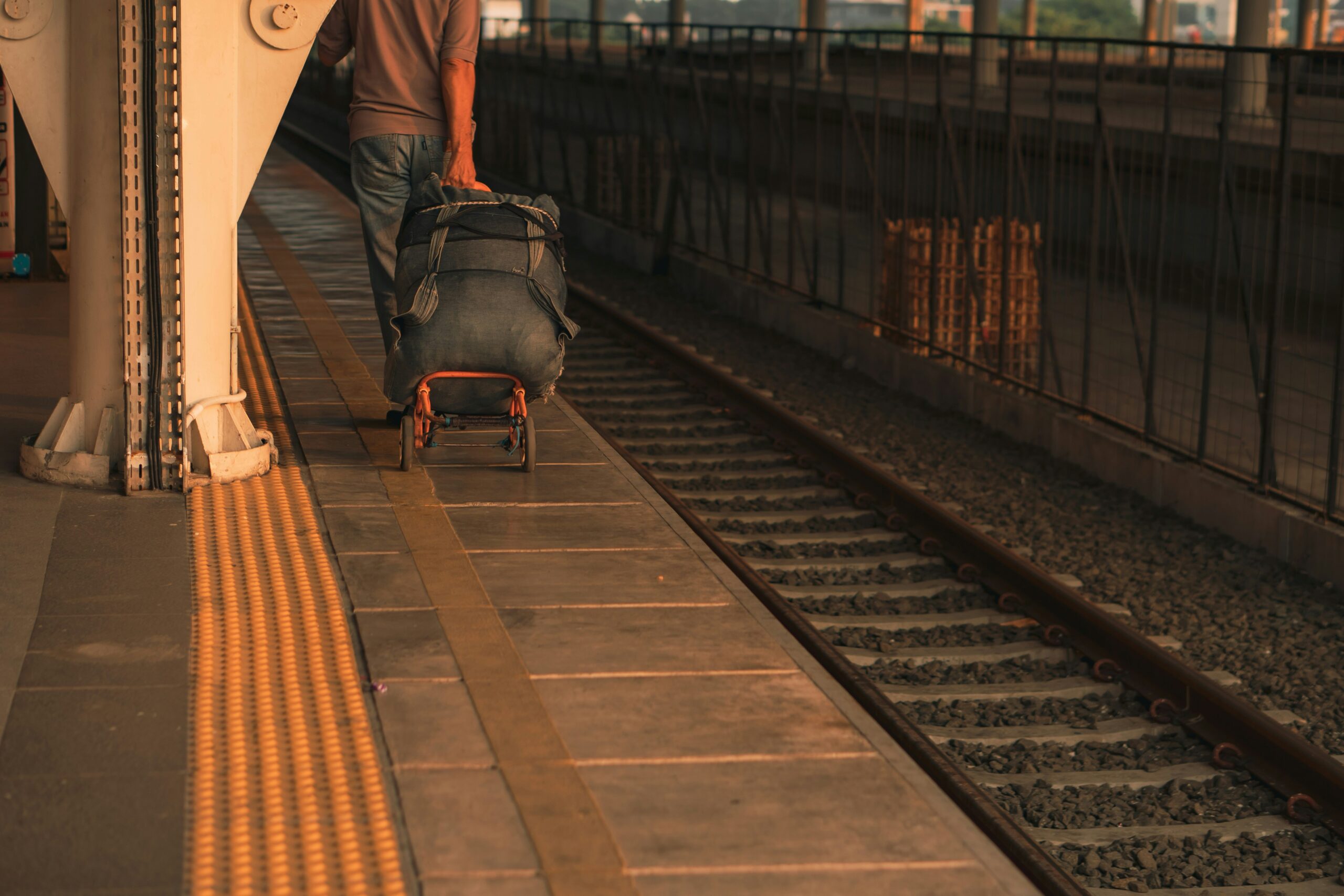 Close-up shot of durable spinner wheels on premium flex pack luggage