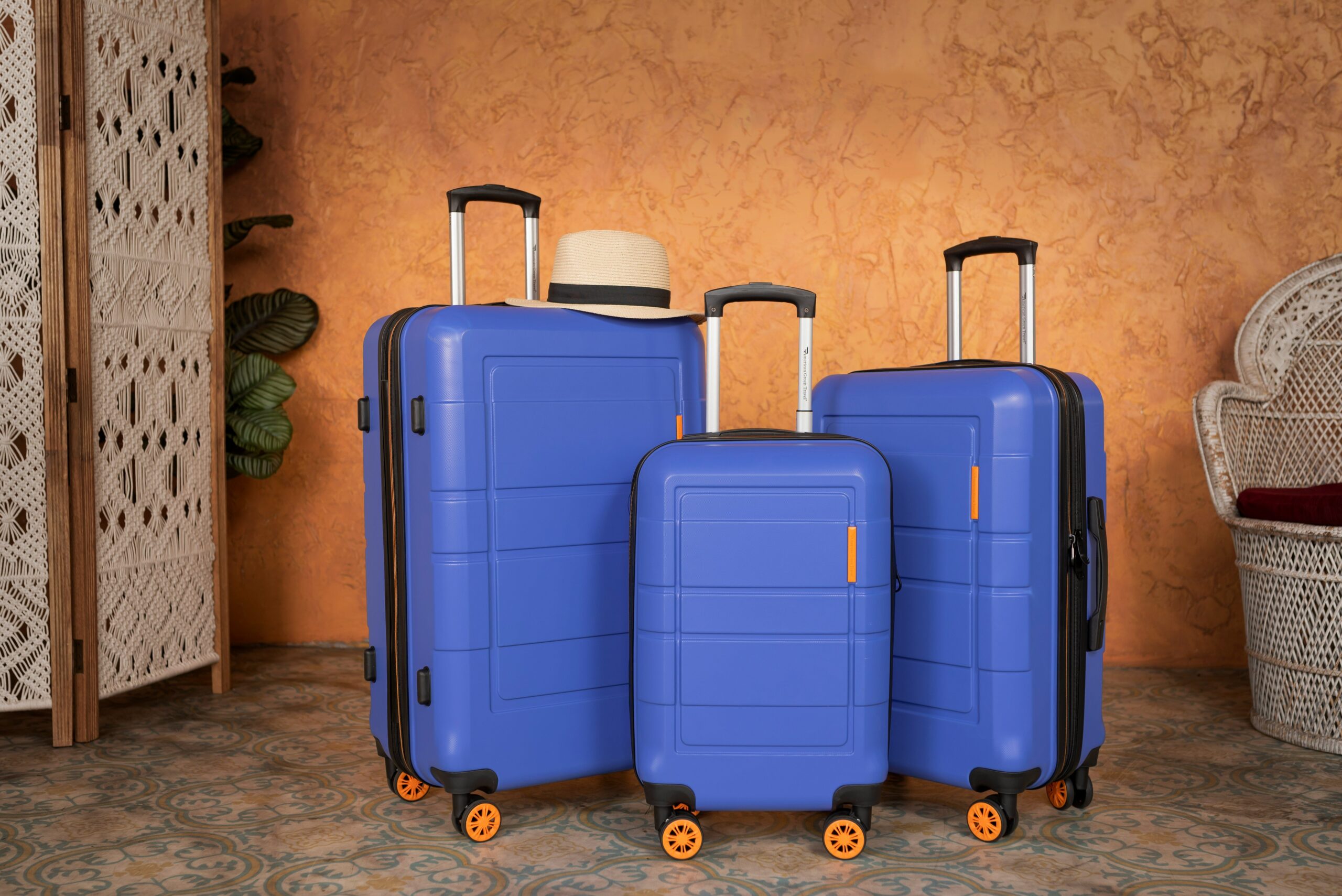 Happy traveler standing next to fully-packed flex pack luggage at airport check-in counter