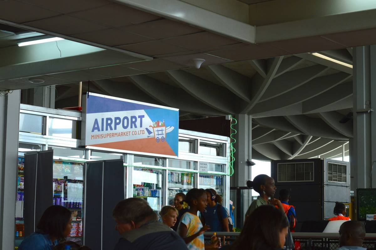 Jane holding her fully packed flex pack trolley bag at an Italian market.
