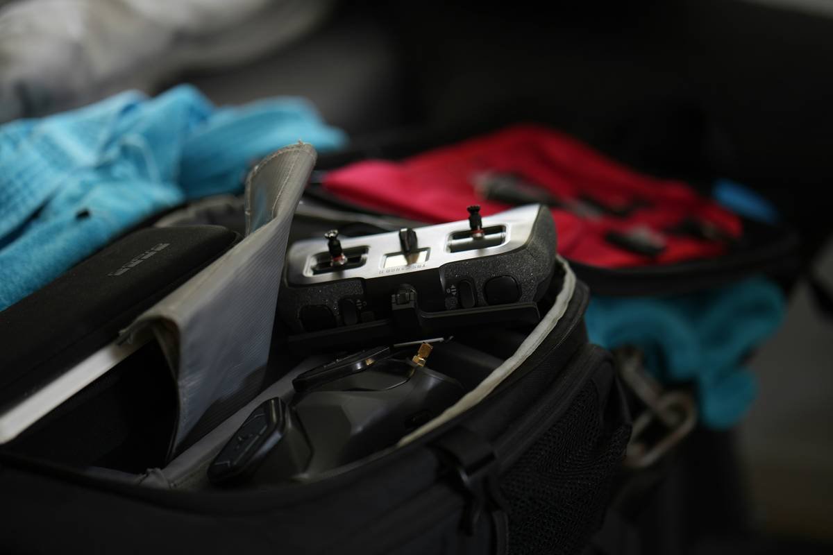 Diagram showing chaotic vs organized expandable luggage compartments with space saver travel organizers reducing dead space